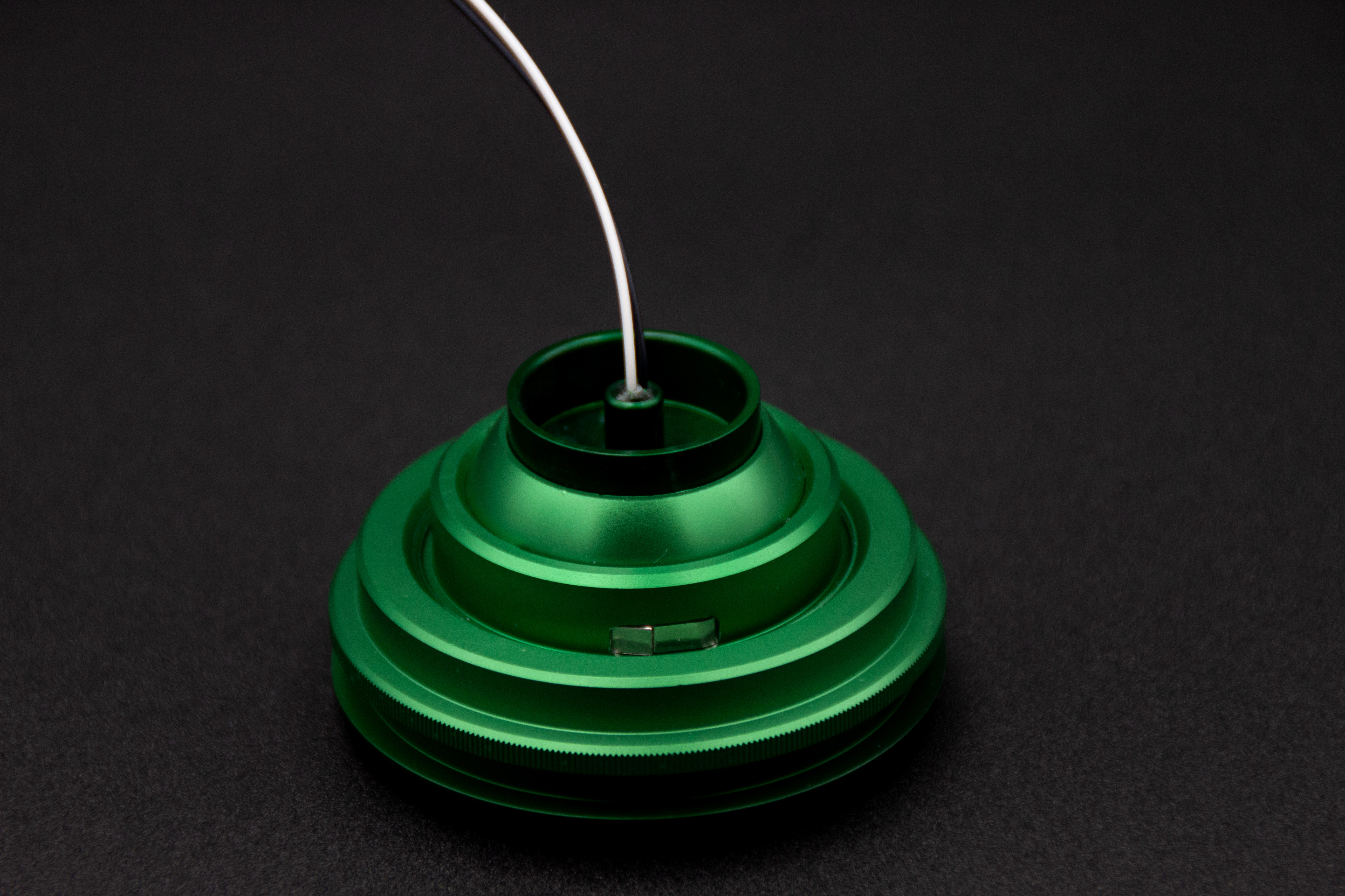 PWI custom LED reading light in green anodized finish, top view Top view of PWI custom LED reading light in green anodized finish showing cable entry and dimmer switch