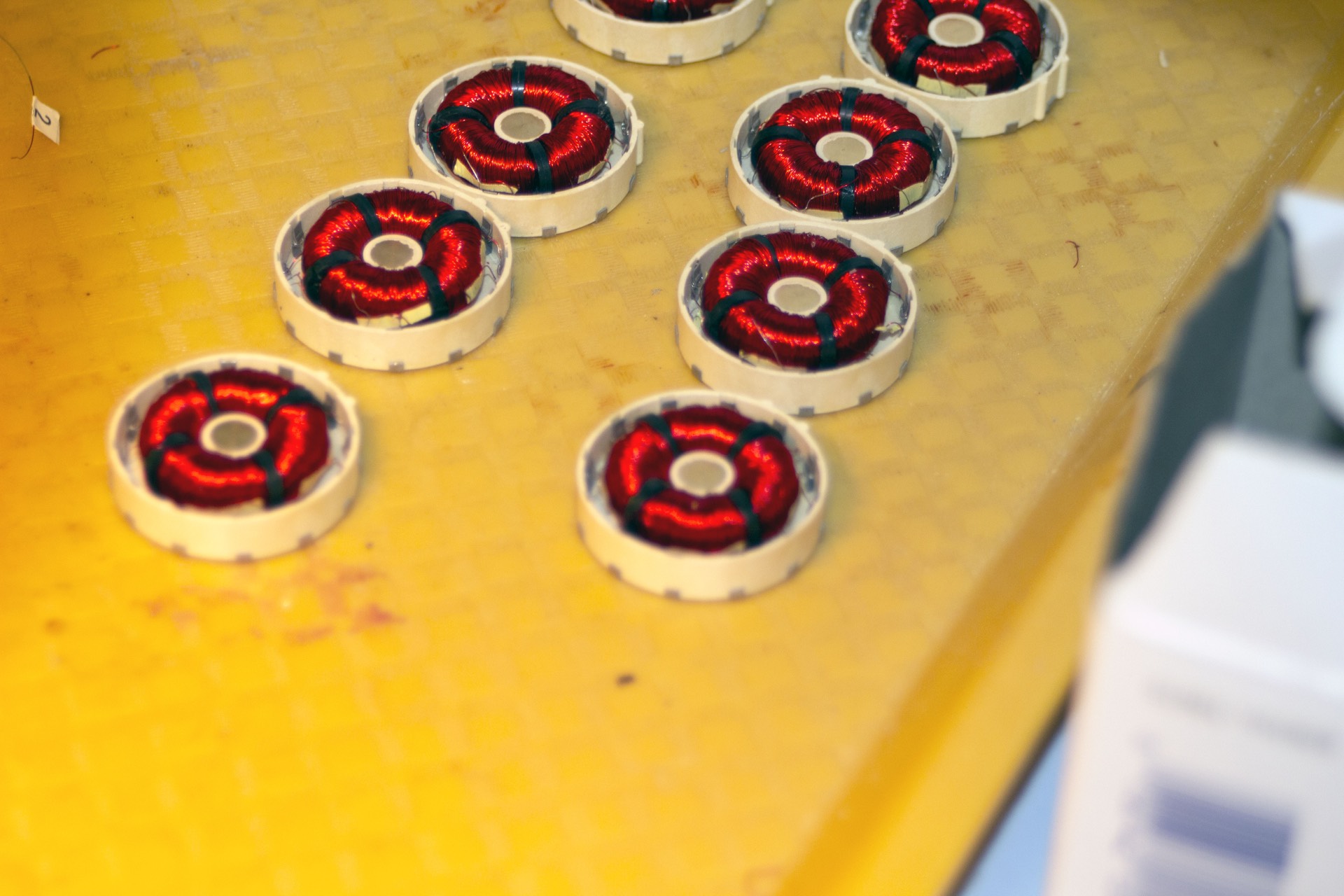 PWI Tape-Wound Bobbin Cores &mdash; two round cores with multi-layer wire windings for magnetometers